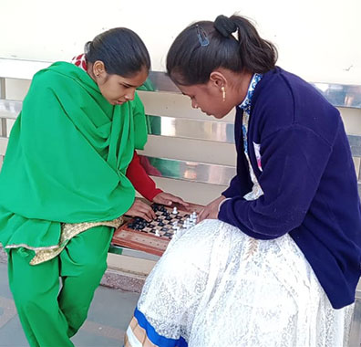 Battle for Blindness NGO's two visually impairement girls playing chess