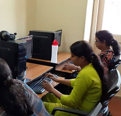 Visually Imapired Girls working on Computers